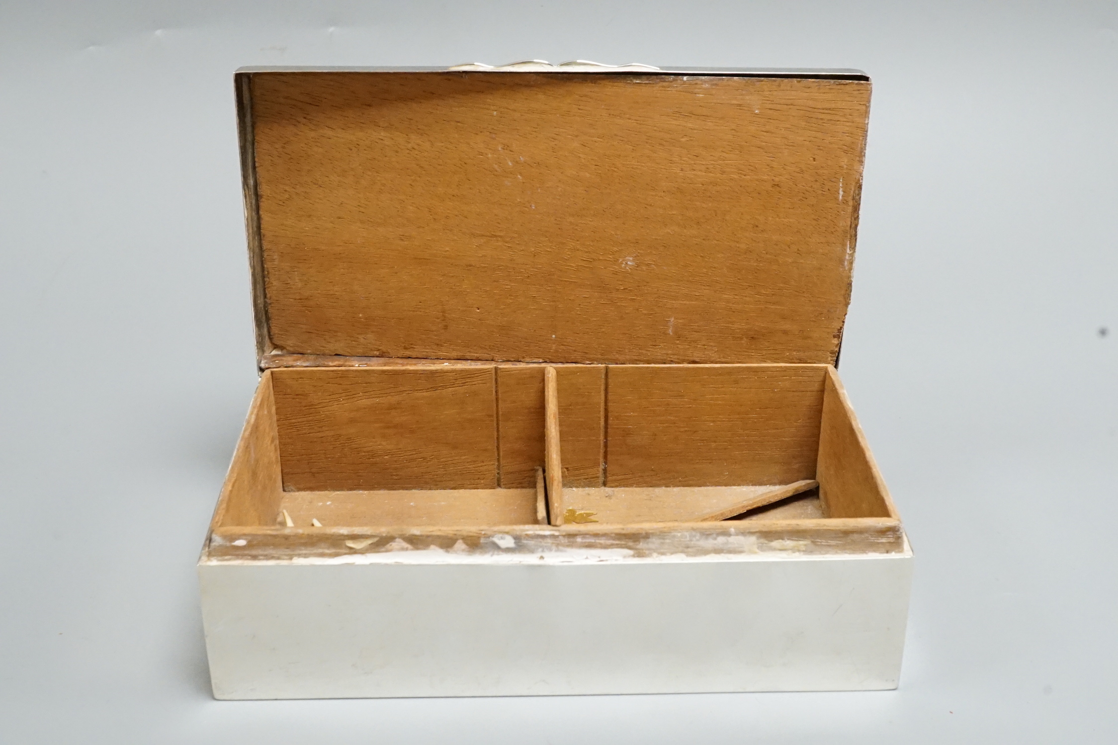 A George V silver mounted rectangular cigarette box, Birmingham, 1928, 17.2cm.